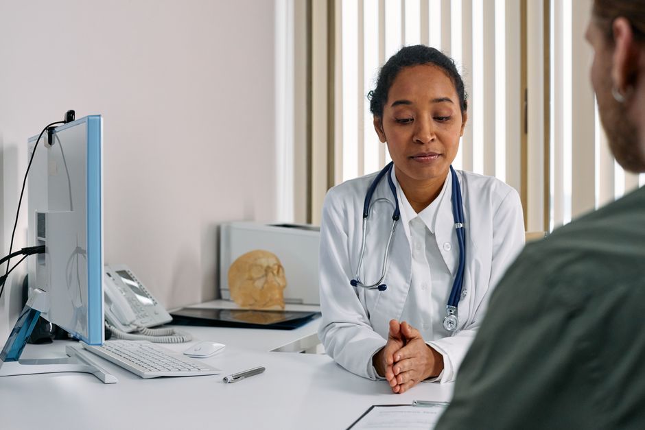 Doctor speaking with a patient during consultation