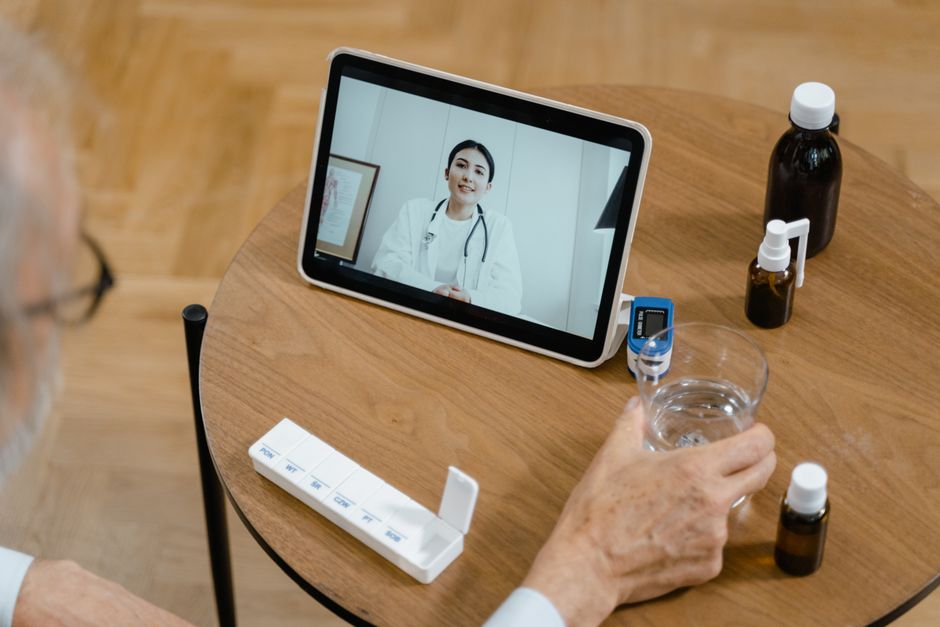 Doctor using a tablet for clinical documentation during a consultation